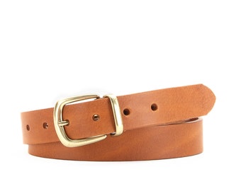 May include: A brown leather belt with a gold buckle. The belt is rolled up and the buckle is visible.