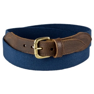 May include: A navy blue canvas belt with a brown leather strap and a gold buckle.