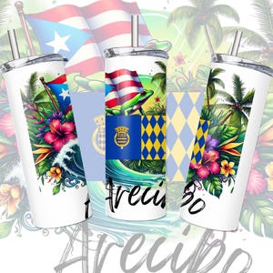 May include: Three white insulated tumblers with tropical designs. Each features a Puerto Rican flag, vibrant flowers, and the word "Arecibo" in black script. Palm trees and ocean waves complete the colorful design.