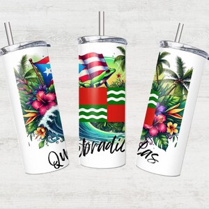 May include: Three white stainless steel tumblers with lids and straws. Each tumbler features a different design with tropical plants, a frog, and a flag. The text "Que Bradi", "Las", and "Que Bradi" are printed on the tumblers.