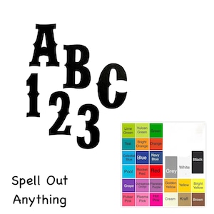 May include: Black wooden letters and numbers, including A, B, C, 1, 2, and 3, are displayed. The phrase "Spell Out Anything" is written below. A color palette with various color names is also shown.