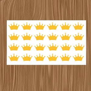 May include: A rectangular white sheet featuring a repeating pattern of twenty-four identical yellow crown icons arranged in four horizontal rows of six, with each crown displaying five points topped with small circles.
