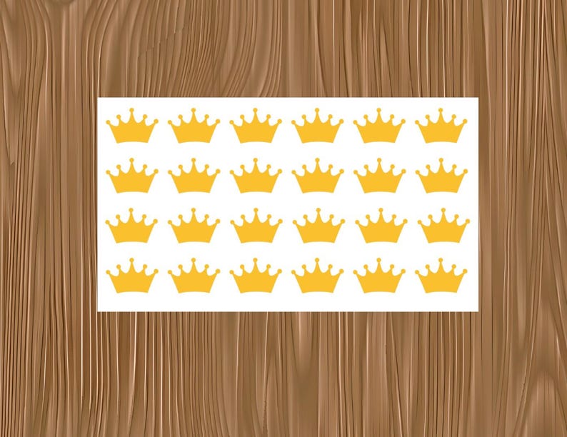 May include: A rectangular white sheet featuring a repeating pattern of twenty-four identical yellow crown icons arranged in four horizontal rows of six, with each crown displaying five points topped with small circles.
