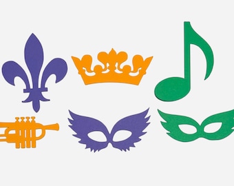 May include: A set of six Mardi Gras party decorations, including a purple fleur-de-lis, a gold crown, a green musical note, a purple mask, and a green mask, and a yellow trumpet.