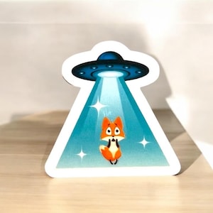 Fox Abduction UFO Sticker | Funny Alien Vinyl Decal | Trippy Space Fox Art | Cute Waterproof Sticker for Cups, Laptops, Gifts