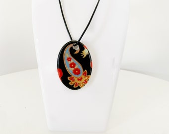 Red and blue oval ceramic pendant necklace, black leather cord, silver clip in clasp, ceramic pendant, black cord necklace.
