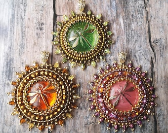 Pendant made of Czech glass dragonfly cabochon braided with Japanese beads and Czech glass beads