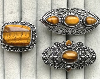 Ring from Tiger eye in a silver frame