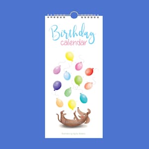 May include: A spiral-bound birthday calendar with a dachshund dog illustration and colorful balloons. The calendar reads "Birthday calendar" in a whimsical font. The illustration is set against a blue background.