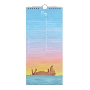 May include: A May wall calendar featuring a dachshund illustration in water. The calendar has a blue and pink gradient background, with the days of the month listed on the left and right. The word "May" is written at the top, above the dates.