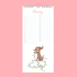 May include: A February calendar page featuring a brown dachshund dog illustration with string lights. The word "February" is in pink script. The calendar has numbered days and a spiral binding. The image is set against a pink background.