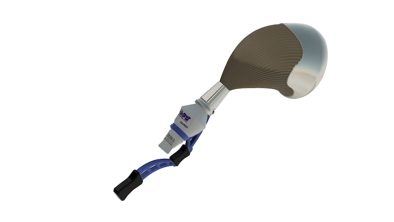May include: A close-up of a prosthetic hip joint with a blue and black metal attachment. The hip joint is made of metal and has a brown plastic liner. The attachment has the word "Sapyr" printed on it.