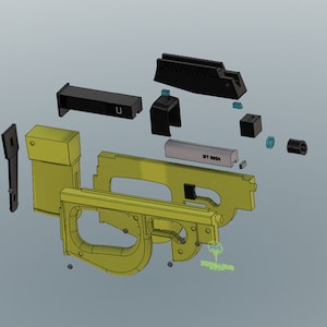 Op de afbeelding: Een gedemonteerd model van een pistool met verschillende onderdelen in zwart en geel. De onderdelen liggen op een grijs oppervlak.
