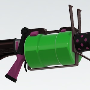 Puede incluir: Un arma de juguete verde y rosa con un mango negro y un ca&ntilde;&oacute;n rosa y negro. El arma tiene un marco de metal y un cilindro verde.