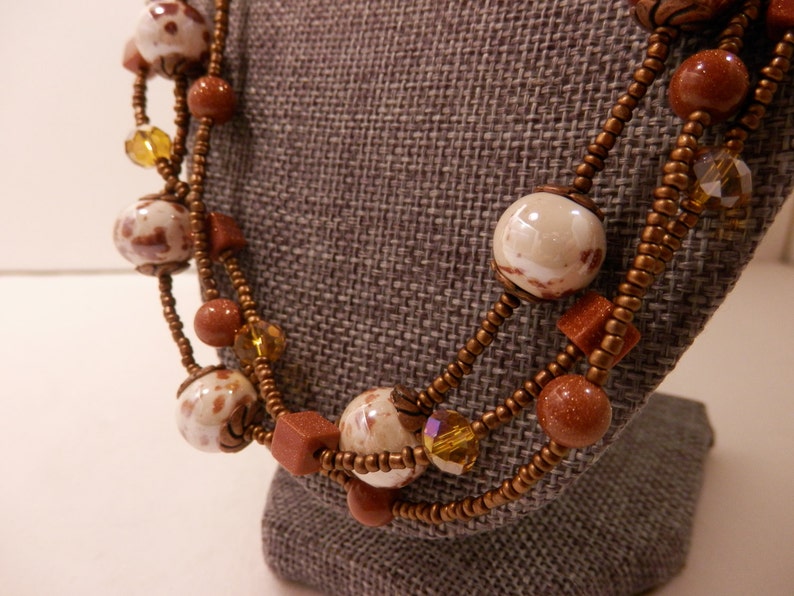 Multistrand Goldstone Necklace with Brown /& White Ceramic Bronze Glass AB Faceted Crystals Antique Copper Accents and Matching Earrings