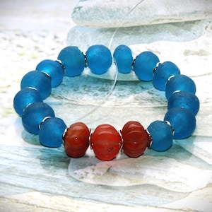 carved antique carnelian beads, silver discs, aqua blue Krobo glass beads, strand length approx. 20 mm