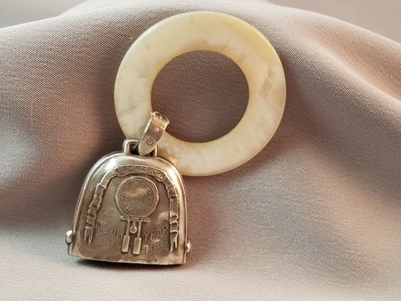vintage metal baby rattle