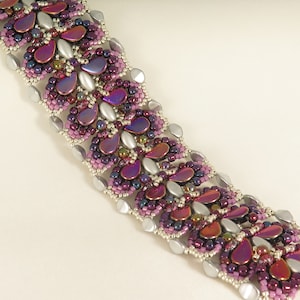 May include: A beaded bracelet with a silver and purple butterfly design.
