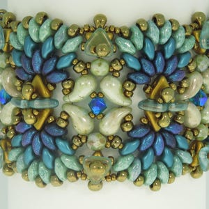 May include: A beaded bracelet with a geometric design featuring teal, green, gold, and blue beads.