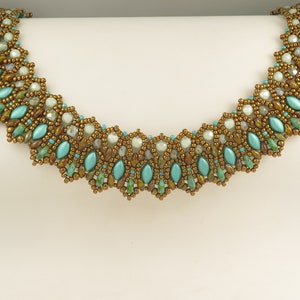 May include: A beaded necklace with a geometric pattern in shades of turquoise, green, and brown.