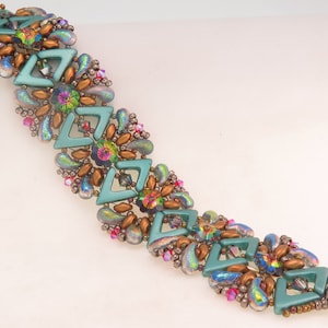 May include: A teal, brown and iridescent beaded bracelet with a geometric design. The bracelet is made with various shapes and sizes of beads, including teardrop, round and square beads.