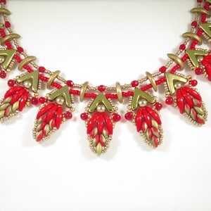 May include: A red and gold beaded necklace with a geometric design. The necklace features a series of teardrop-shaped pendants that are made up of small red and gold beads.