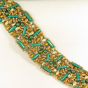 May include: A beaded bracelet with a geometric pattern in gold, green, and white.