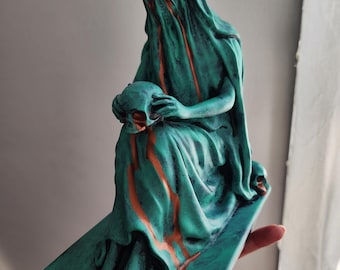 Bronze graveyard statues