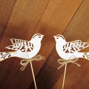 Two wedding cake topper lace birds in rustic aged white