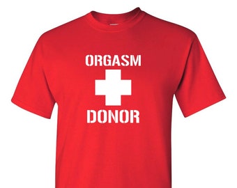 May include: Red t-shirt with white text that reads "ORGASM DONOR" and a white plus sign.