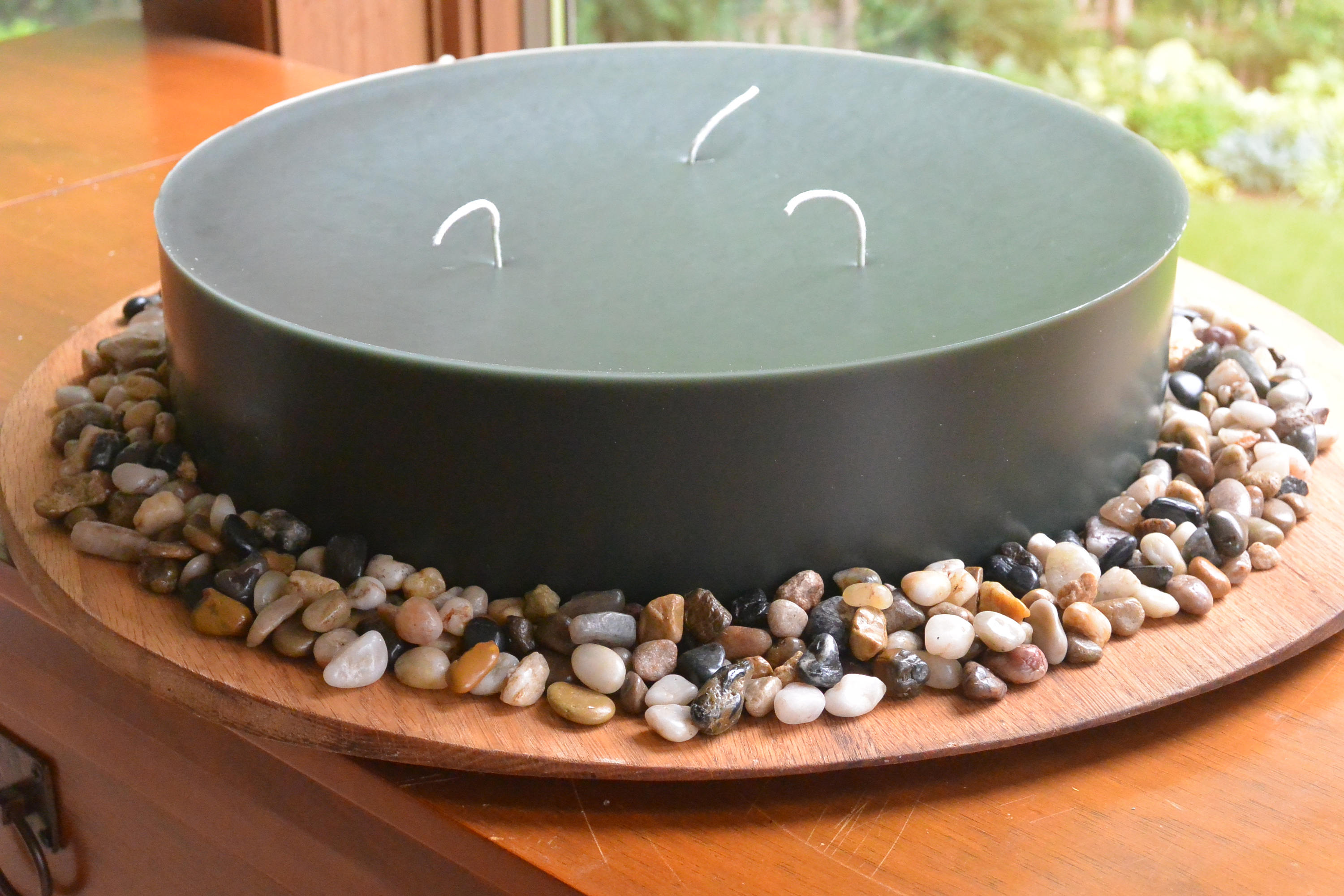 Hand poured 12 inch candle (3 in tall) round candle with 3 cotton wicks. Dark forest green and