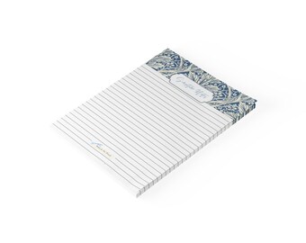 May include: A rectangular notepad with white lined paper. The top section features a blue and white floral pattern with the text "Scripture Notes" in a decorative frame. A small logo with the text "Walk By Wind" is printed in the bottom left corner.