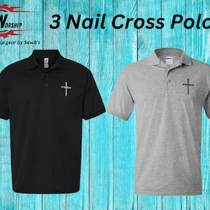 May include: Two polo shirts with a 3 Nail Cross design. One shirt is black and the other is gray. The shirts are on a blue wooden background. The text "Worship gear by SewB's" is at the bottom of the image.