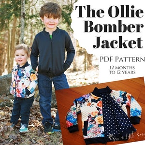May include: Two children wearing bomber jackets. One jacket is solid black, the other is a floral print. The image includes the text "The Ollie Bomber Jacket PDF Pattern 12 Months to 12 Years."