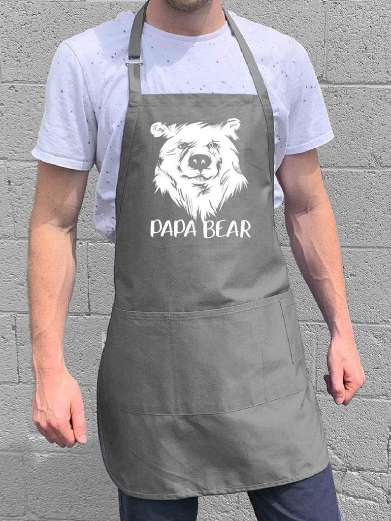 May include: A gray apron with a white bear illustration and the text "Papa Bear".