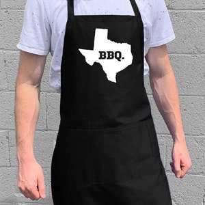 Texas State BBQ / Grill- och kökspresent till män, pappa eller morfar / 100 % bomull / Stor 1 storlek passar alla med justerbar halsringning