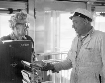 Man and cashier in the diner, by Marvin Koner