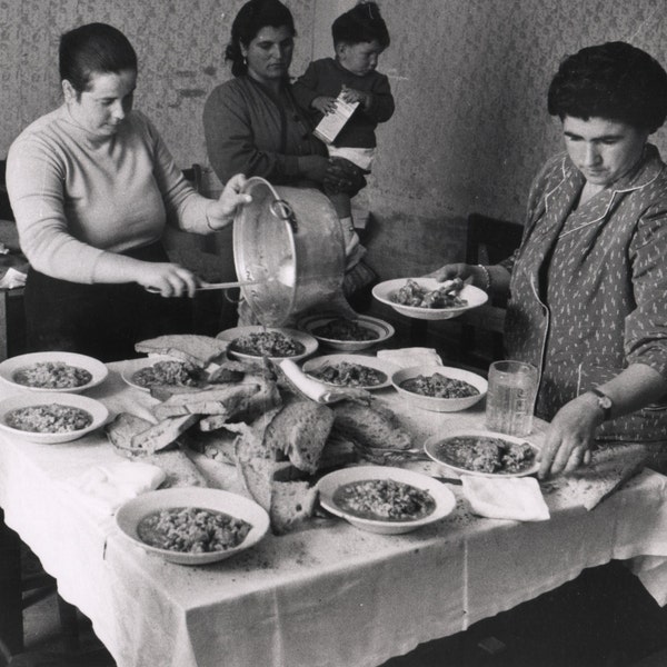 Italian women prepare a meal, by Marvin Koner