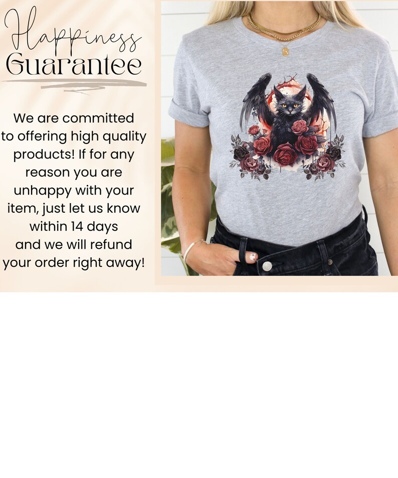 May include: A light gray t-shirt featuring a black cat with bat wings, yellow eyes, and surrounded by red and black roses. The cat is centered on the shirt, with a circular design behind it. The shirt has rolled-up sleeves.