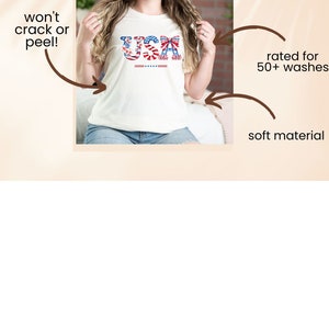 May include: A white t-shirt with a red, white, and blue USA graphic featuring a bow. The graphic is made up of flowers and stars. The shirt is made with a soft material and is rated for 50+ washes.