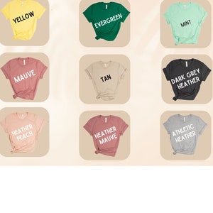 May include: Color chart showing different t-shirt colors, including yellow, evergreen, mint, mauve, tan, dark grey heather, heather peach, heather mauve, and athletic heather.
