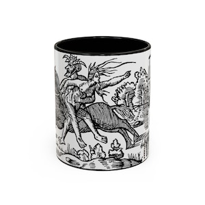 May include: White ceramic mug with a black interior featuring a black and white illustration. The illustration depicts a mythological scene with figures riding a creature, set against a landscape. The mug is cylindrical.