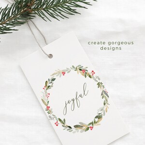 May include: A white gift tag with a green watercolor wreath with red berries and the word "joyful" in the center. The text "create gorgeous designs" is at the top of the tag and the text "www.essemcreatives.com" is at the bottom.