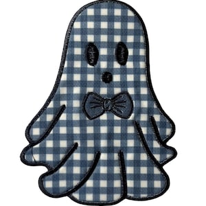 May include: A blue and white gingham ghost with a black bow tie. The ghost has black eyes and a black mouth.