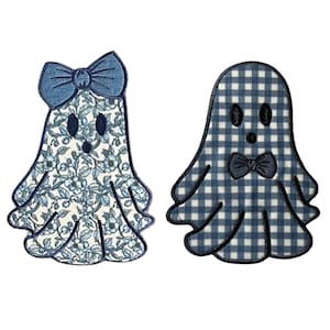 May include: Two blue and white ghost appliques. One ghost has a blue bow and a floral pattern. The other ghost has a blue and white gingham pattern and a blue bow tie.