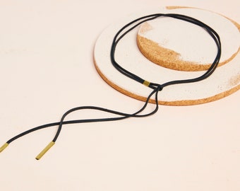 Leather and brass lariat