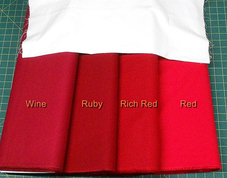 May include: Four fabric swatches in different shades of red, labeled "Wine", "Ruby", "Rich Red", and "Red".