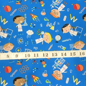 May include: Blue fabric with a repeating pattern of cartoon scientists, lab equipment, and chemical formulas. The fabric includes a ruler with inches marked.