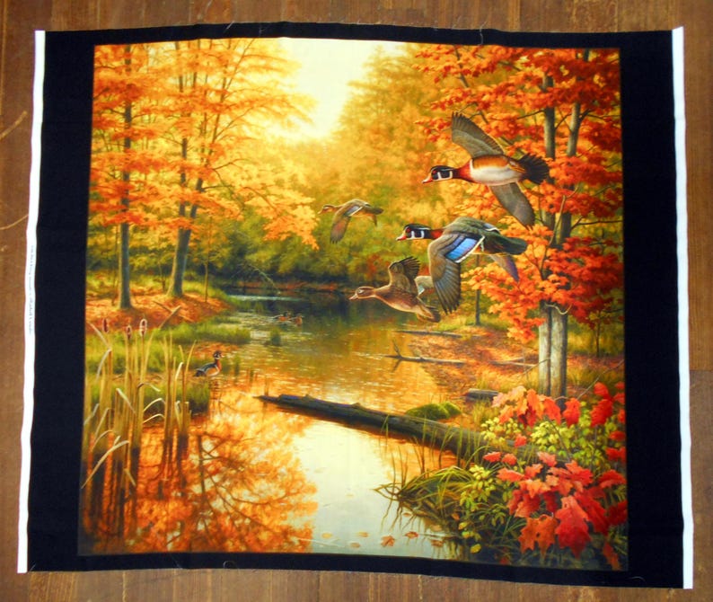 May include: A painting of a forest scene with a stream running through it. The trees have orange, yellow, and red leaves. There are four wood ducks flying over the stream.