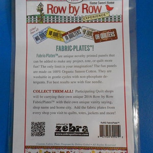 May include: A white card with a colorful illustration of houses and a red bird. The text "Row by Row Experience" is printed in black. The text "Fabric-Plates!" is printed in black. The text "Collect them all!" is printed in black. The text "Participating Quilt shops will be carrying their own unique 2016 Row by Row FabricPlates&trade; with their own unique vanity saying. shop name and home city. Add the fabric plates from every shop you visit to quilts, totes, jackets and more!" is printed in black. The text "Custom Fabric Plate Program by Debra Gabel All Rights Reserved" is printed in black. The text "patterned by zebra www.zebrapatterns.com" is printed in black. The text "RxRE FabricPlate&trade;" is printed in black. A barcode is printed in black.